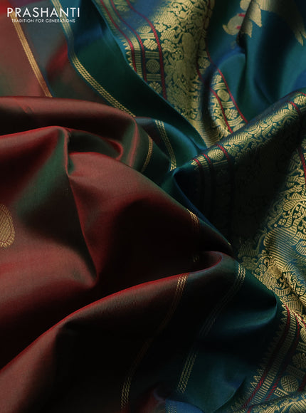 Pure kanchipuram silk saree dual shade of maroon and peacock green with paisley zari woven buttas and rettapet zari woven border