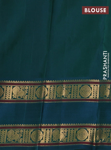 Pure kanchipuram silk saree dual shade of maroon and peacock green with paisley zari woven buttas and rettapet zari woven border