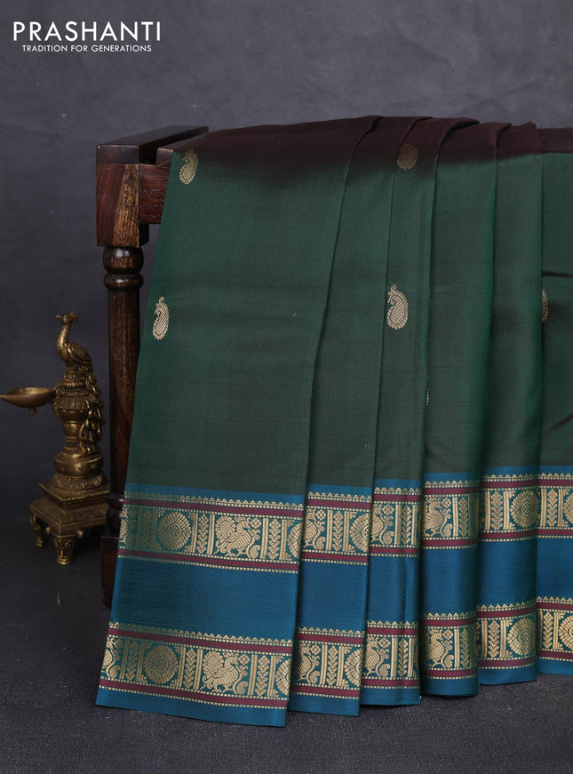 Pure kanchipuram silk saree bottle green and peacock green with paisley zari woven buttas and rettapet zari woven border