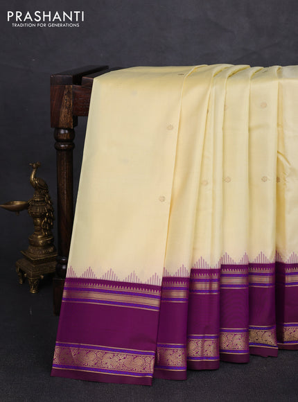 Pure kanchipuram silk saree cream and wine shade with zari woven buttas and temple design rettapet zari woven border