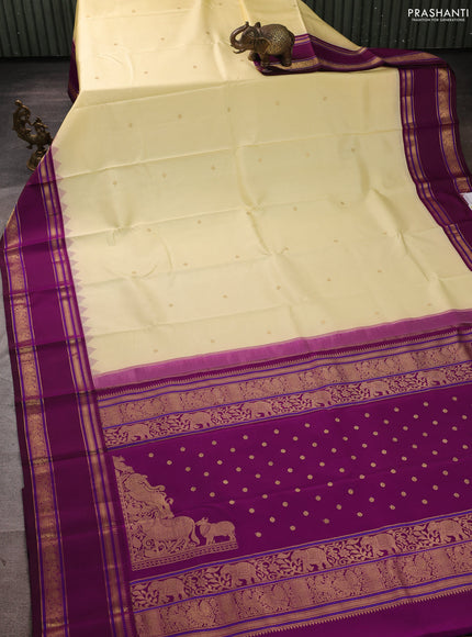 Pure kanchipuram silk saree cream and wine shade with zari woven buttas and temple design rettapet zari woven border