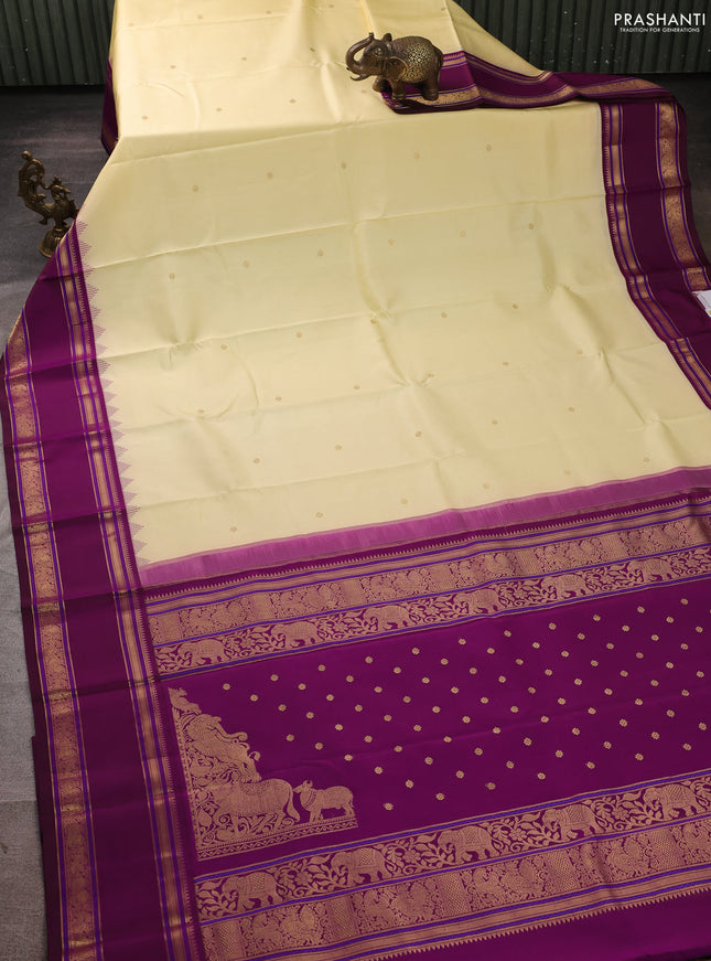 Pure kanchipuram silk saree cream and wine shade with zari woven buttas and temple design rettapet zari woven border