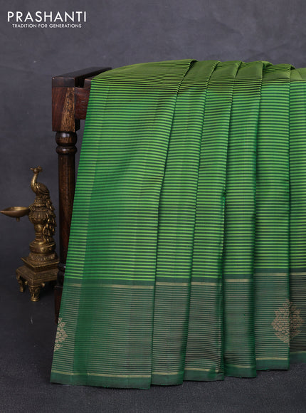 Pure kanchipuram silk saree light green and green with allover stripe pattern and zari woven border