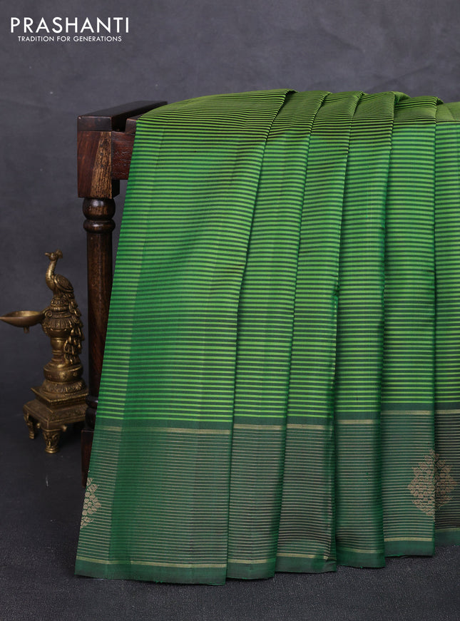 Pure kanchipuram silk saree light green and green with allover stripe pattern and zari woven border