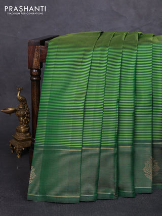 Pure kanchipuram silk saree light green and green with allover stripe pattern and zari woven border