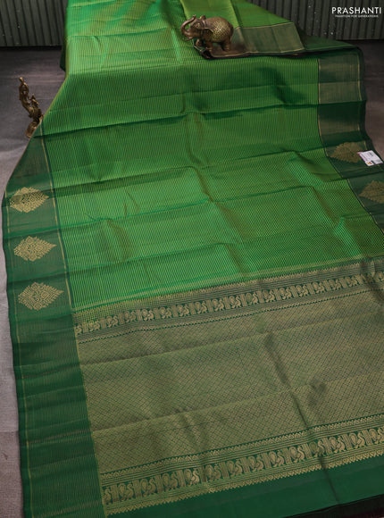 Pure kanchipuram silk saree light green and green with allover stripe pattern and zari woven border