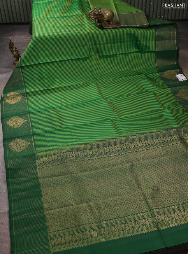 Pure kanchipuram silk saree light green and green with allover stripe pattern and zari woven border