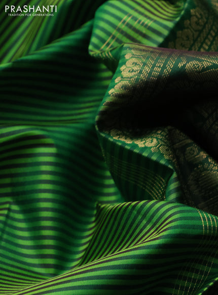 Pure kanchipuram silk saree light green and green with allover stripe pattern and zari woven border