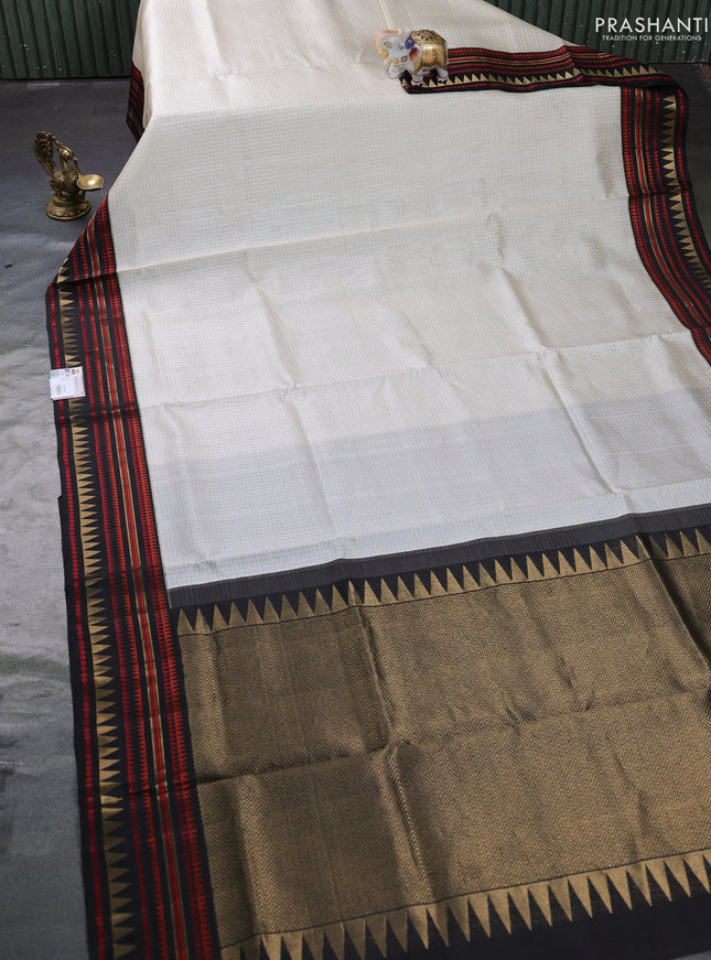 Pure kanchipuram silk saree cream and black with allover zari checked pattern and woven border