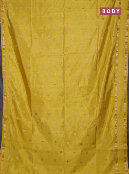 Semi raw silk saree yellow with allover zari woven buttas and rettapet zari woven border