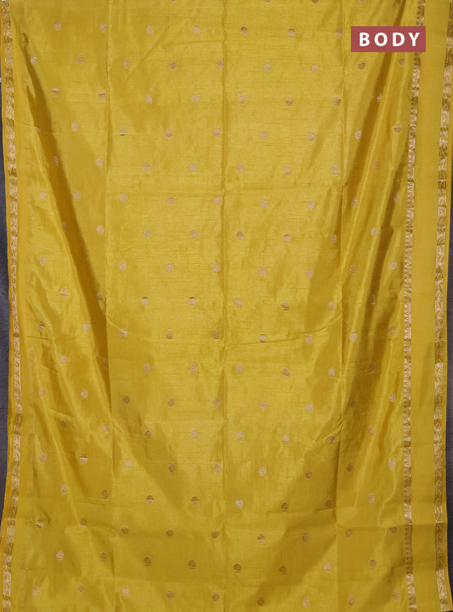 Semi raw silk saree yellow with allover zari woven buttas and rettapet zari woven border