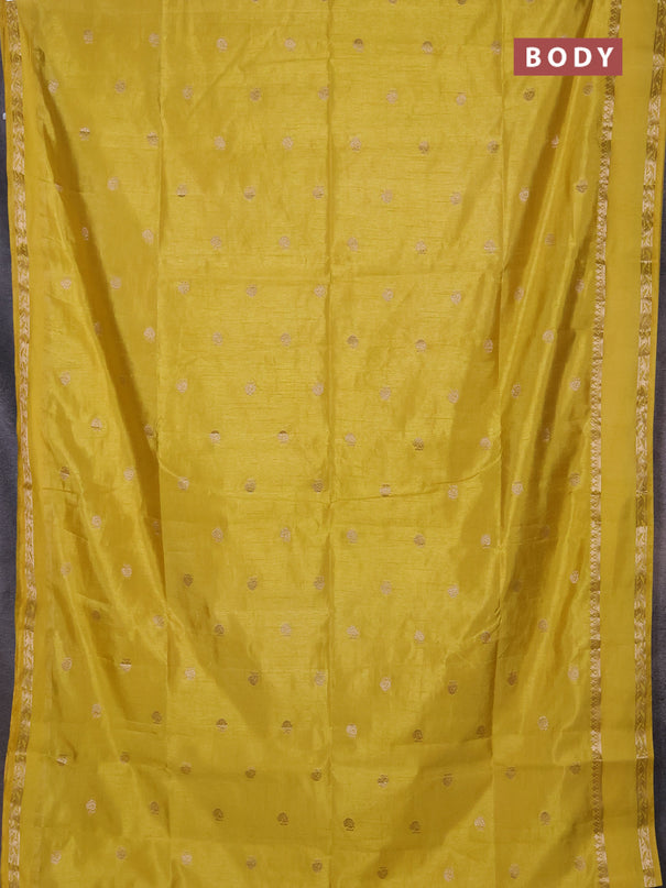 Semi raw silk saree yellow with allover zari woven buttas and rettapet zari woven border
