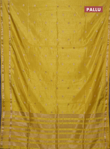 Semi raw silk saree yellow with allover zari woven buttas and rettapet zari woven border