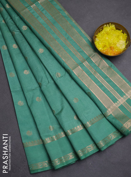 Semi raw silk saree pastel green with allover zari woven buttas and rettapet zari woven border