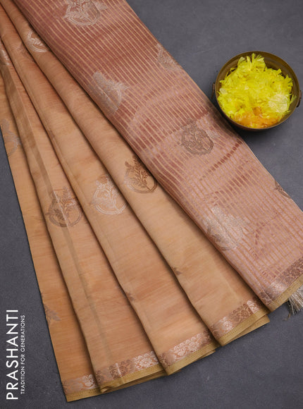 Semi raw silk saree peach shade with zari woven buttas and small zari woven border