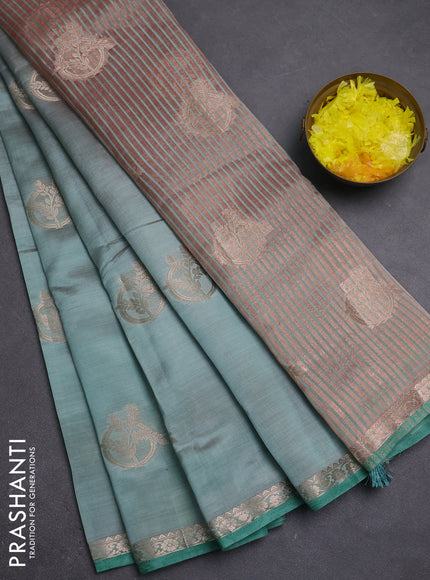 Semi raw silk saree pastel green with zari woven buttas and small zari woven border