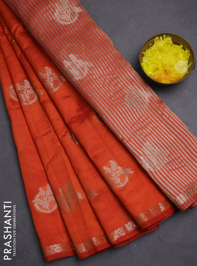 Semi raw silk saree rust shade with zari woven buttas and small zari woven border