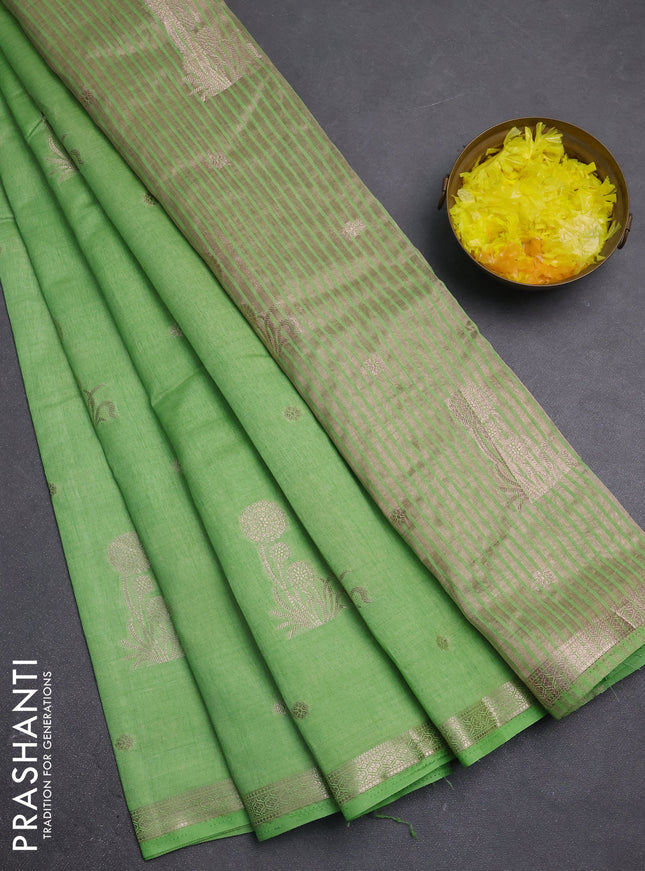 Semi raw silk saree light green with zari woven buttas and small zari woven border