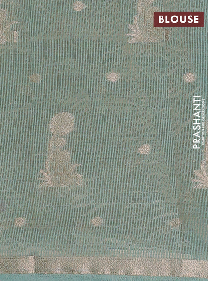 Semi raw silk saree pastel green with zari woven buttas and small zari woven border