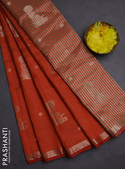 Semi raw silk saree rust shade with zari woven buttas and small zari woven border