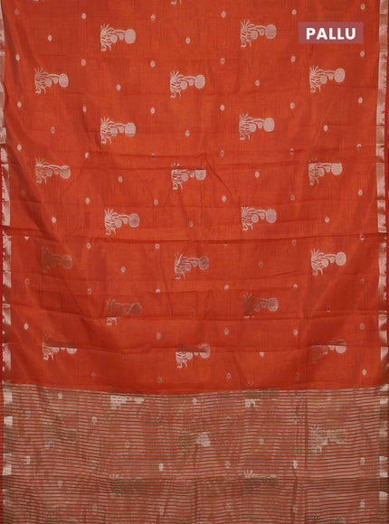 Semi raw silk saree rust shade with zari woven buttas and small zari woven border
