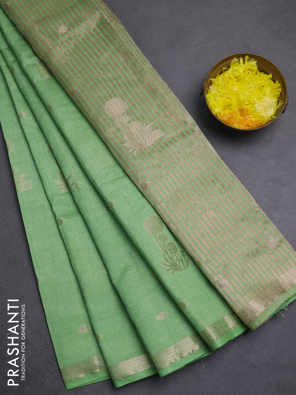 Semi raw silk saree light green shade with zari woven buttas and small zari woven border