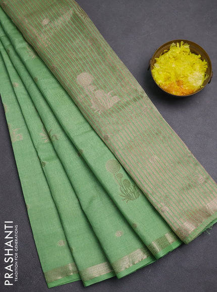 Semi raw silk saree light green shade with zari woven buttas and small zari woven border
