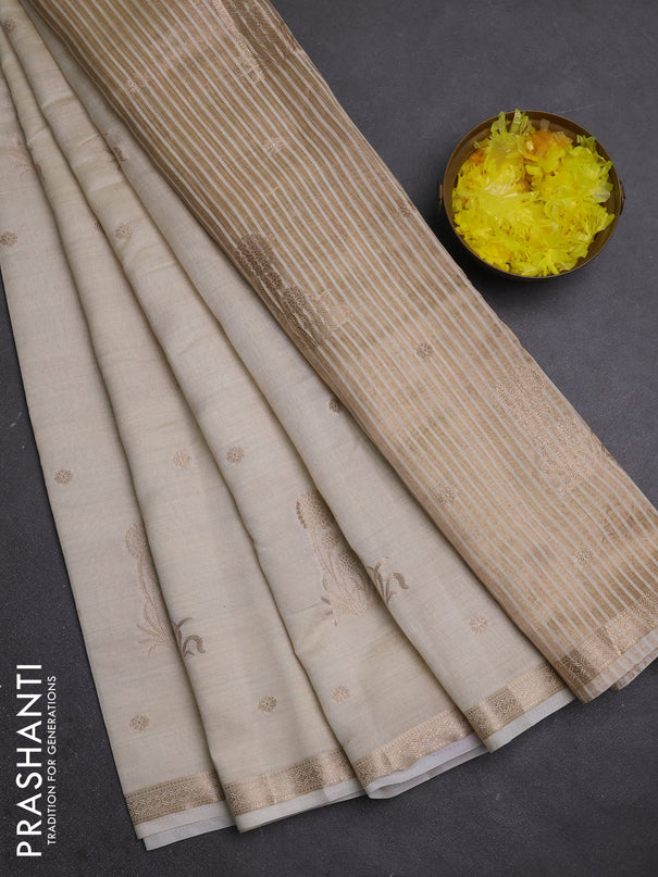 Semi raw silk saree cream with zari woven buttas and small zari woven border