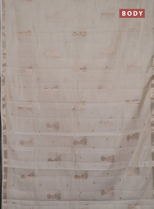 Semi raw silk saree cream with zari woven buttas and small zari woven border