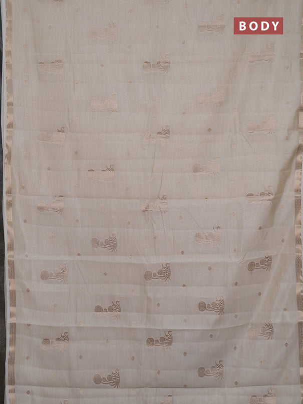 Semi raw silk saree cream with zari woven buttas and small zari woven border