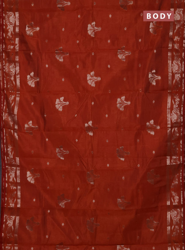 Semi raw silk saree rust shade with zari woven buttas and zari woven border