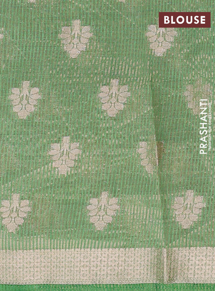 Semi raw silk saree light green with allover zari woven buttas and zari woven border