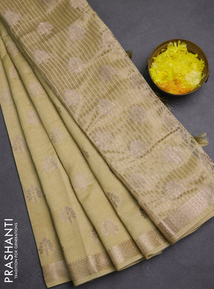 Semi raw silk saree beige with allover zari woven buttas and zari woven border