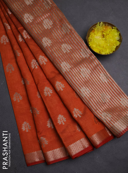 Semi raw silk saree rust shade with allover zari woven buttas and zari woven border