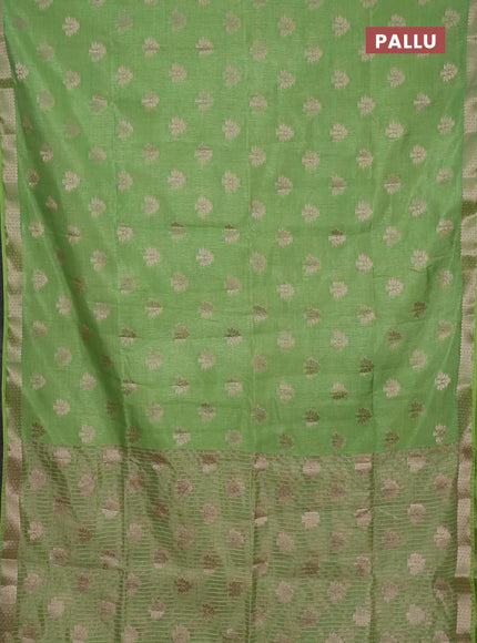 Semi raw silk saree light green with allover zari woven buttas and zari woven border