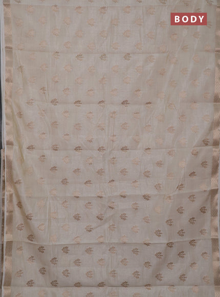 Semi raw silk saree cream with allover zari woven buttas and zari woven border