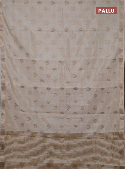 Semi raw silk saree cream with allover zari woven buttas and zari woven border