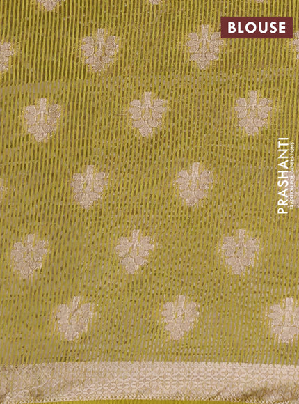 Semi raw silk saree lime green with allover zari woven buttas and zari woven border