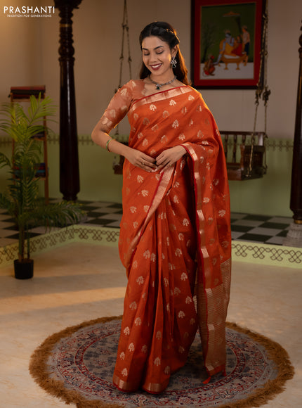 Semi raw silk saree rustic orange with allover zari woven buttas and zari woven border