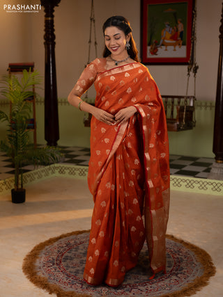Semi raw silk saree rustic orange with allover zari woven buttas and zari woven border