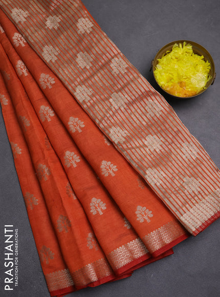 Semi raw silk saree rustic orange with allover zari woven buttas and zari woven border