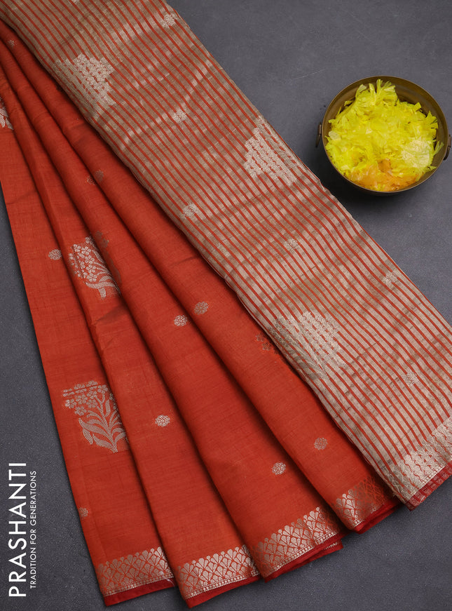 Semi raw silk saree rust shade with zari woven buttas and zari woven border
