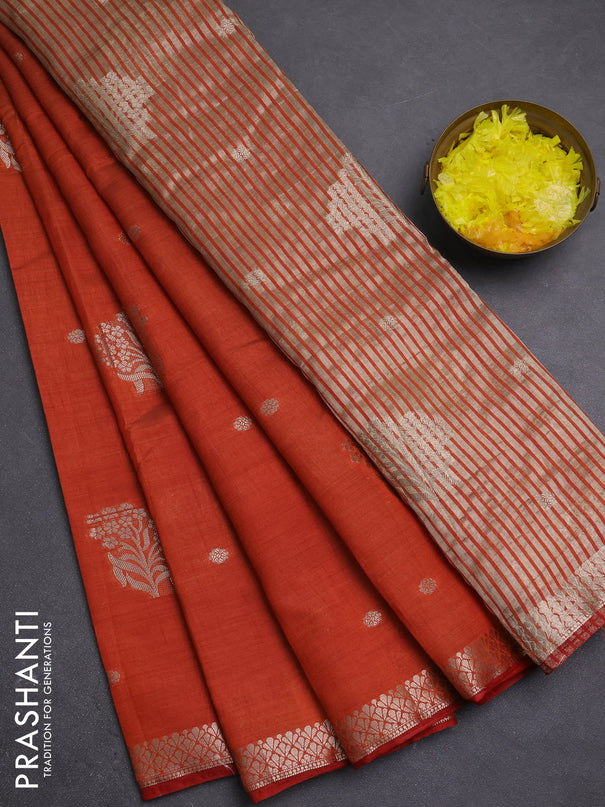 Semi raw silk saree rust shade with zari woven buttas and zari woven border