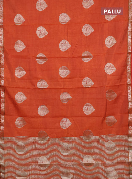 Semi raw silk saree rust shade with zari woven buttas and zari woven border