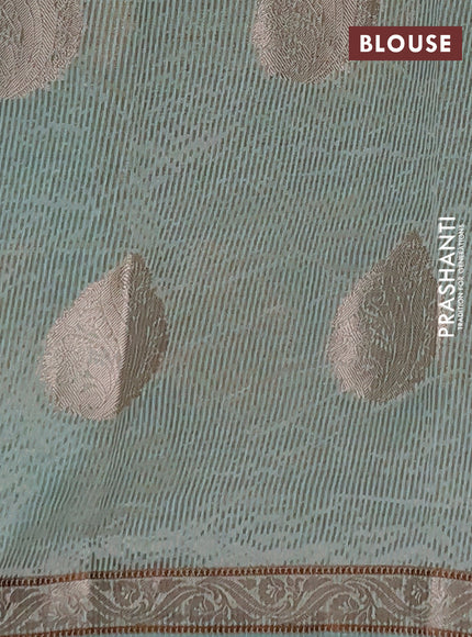 Semi raw silk saree pastel green with zari woven buttas and zari woven border