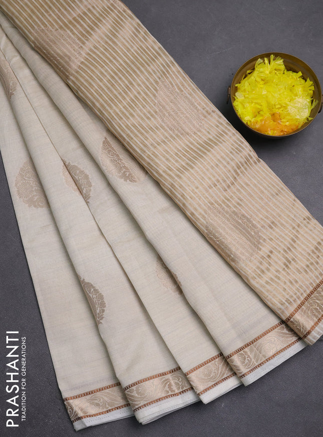 Semi raw silk saree cream with zari woven buttas and zari woven border