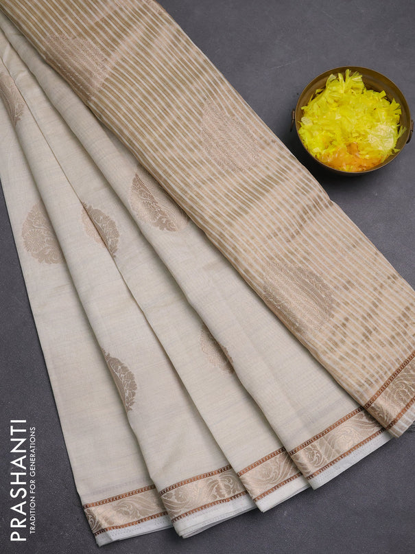 Semi raw silk saree cream with zari woven buttas and zari woven border