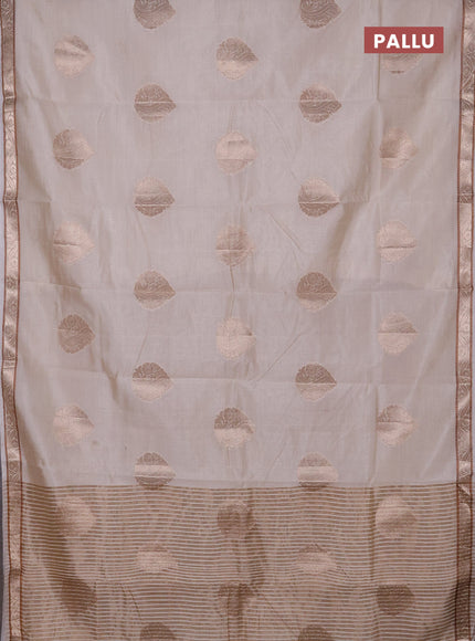 Semi raw silk saree cream with zari woven buttas and zari woven border
