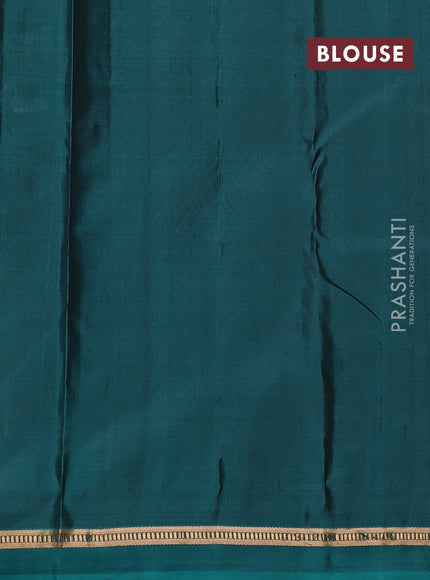 Pure kanchipuram silk saree black and teal green with zari woven buttas and zari woven simple border