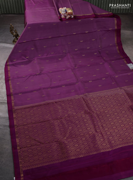 Pure kanchipuram silk saree pink shade and pink with allover paisley zari woven buttas and zari woven simple border